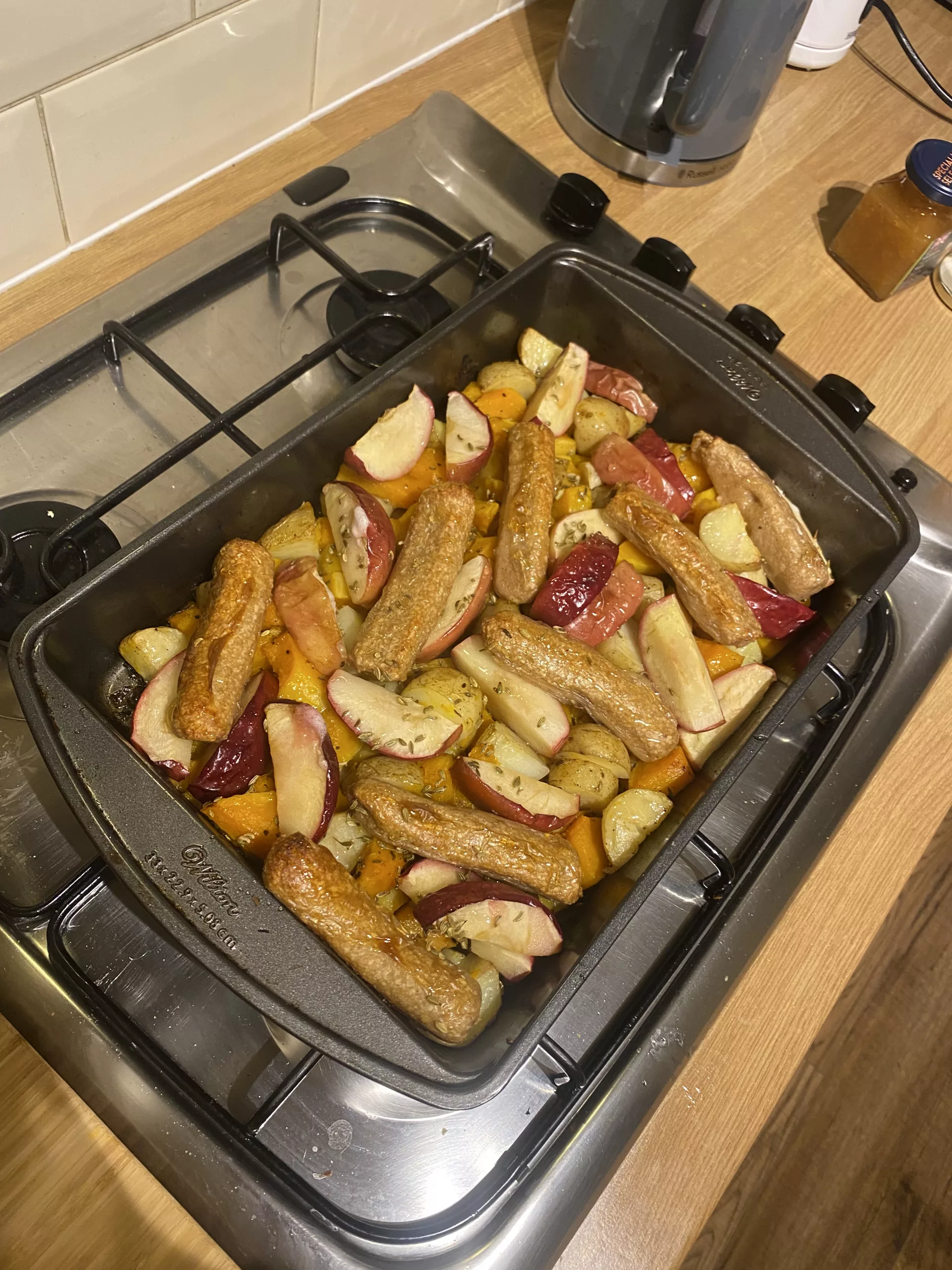 Sausage, apple, and fennel traybake